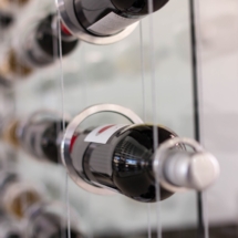 Close-up of Suspended Wine Rack Rings with Wine