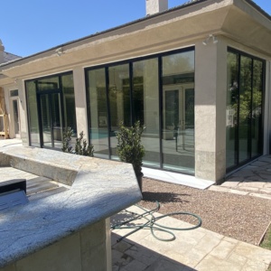 French aluminum door with storefront and low e glass enclosing patio